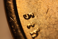 front of a james monroe dollar coin